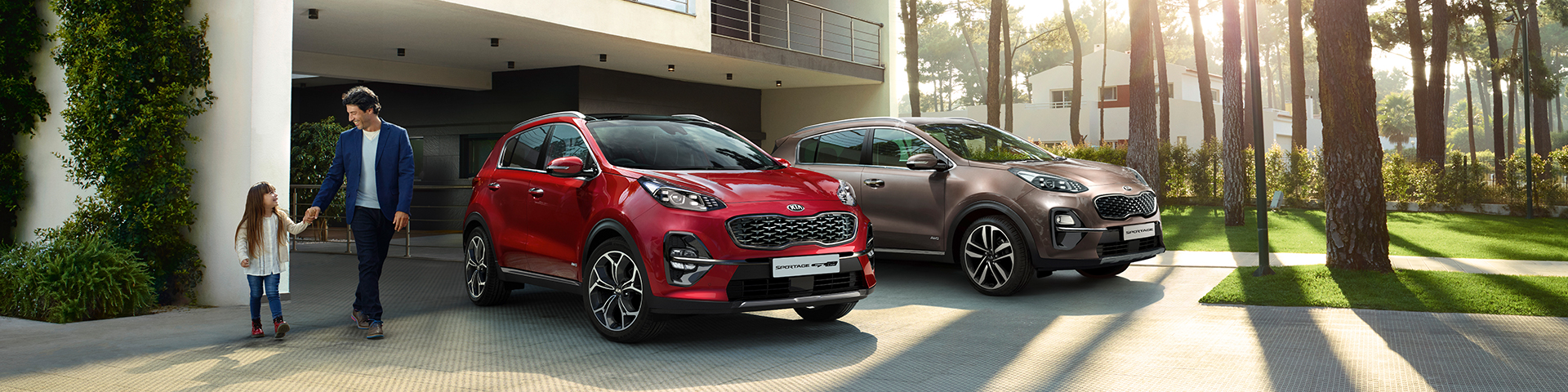 Father with daughter on their way to the car which has lots of accessories