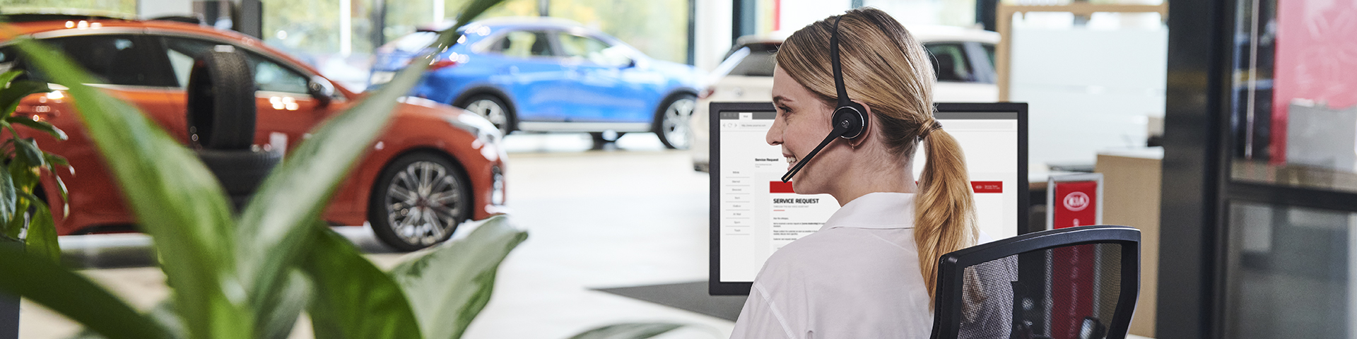 Service advisor standing at the front desk and greeting the customer